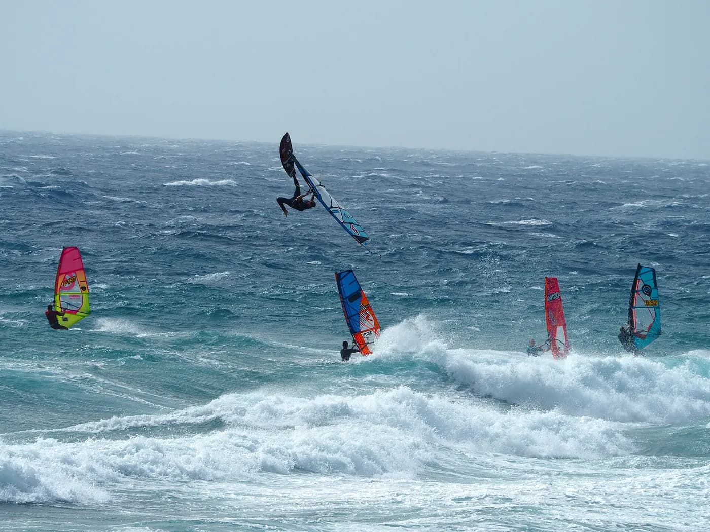 Windsurfer on a shorter freeride board near shore