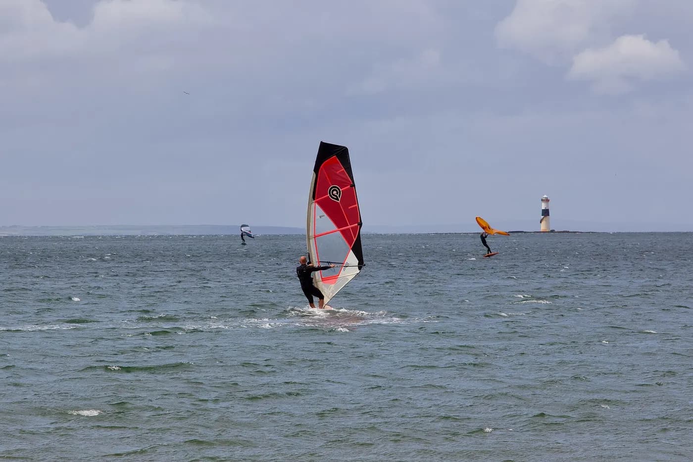 Windsurfer on a freeride sail in choppy coastal wind